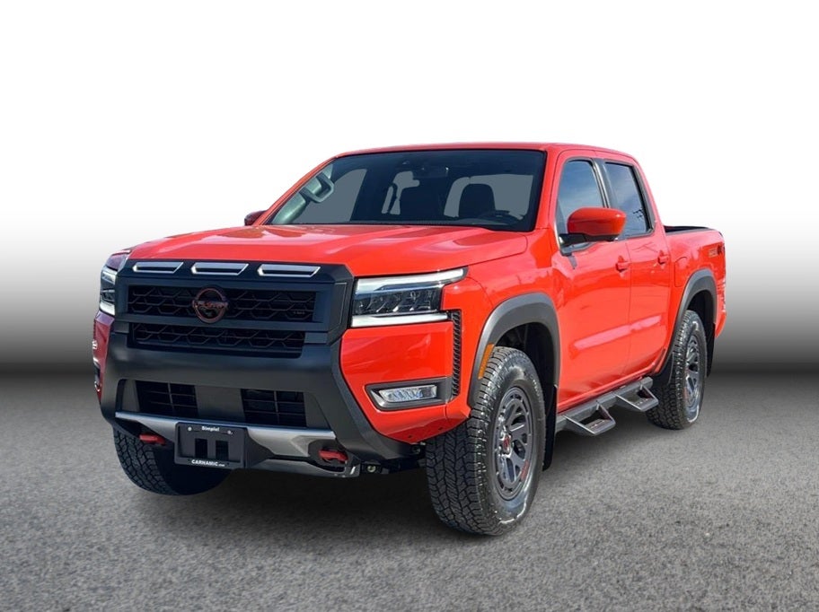 2025 Nissan Frontier PRO-4X in Afterburn Orange — front three-quarter view